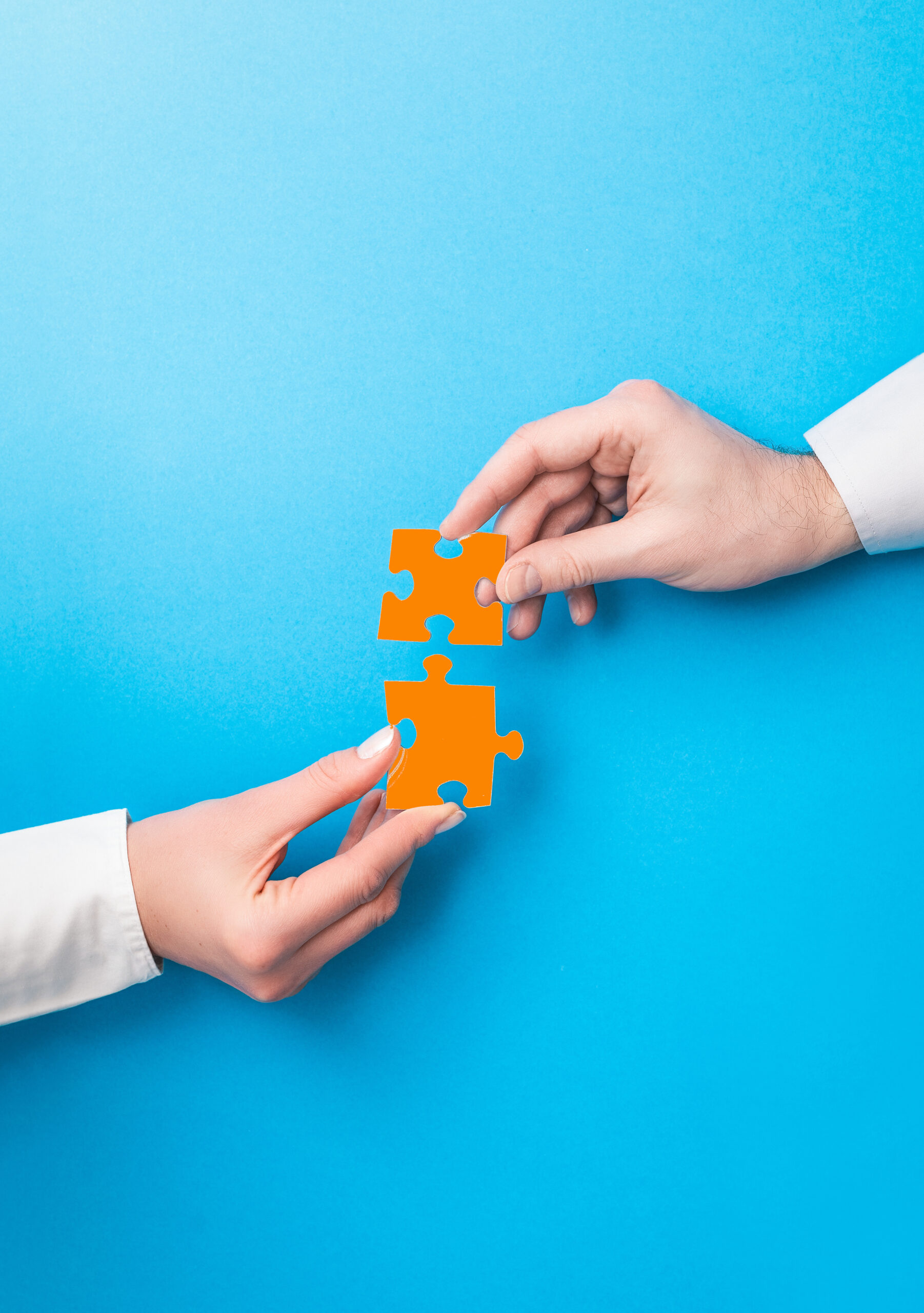 People holds in hand a jigsaw puzzle. Business solutions, succes